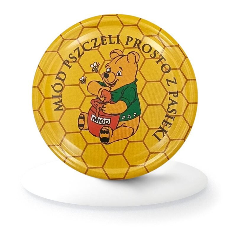 Zakrętka do słoika z miodem z ilustracją misia i napisem "Miód pszczeli prosto z pasieki"